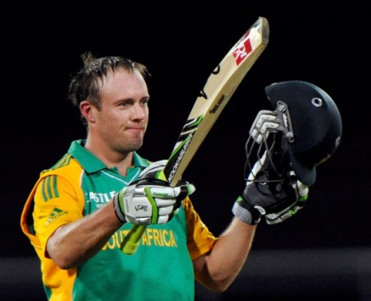 South Africa's De Villiers signals his 100 against New Zealand during their first one-day international cricket match in Wellington